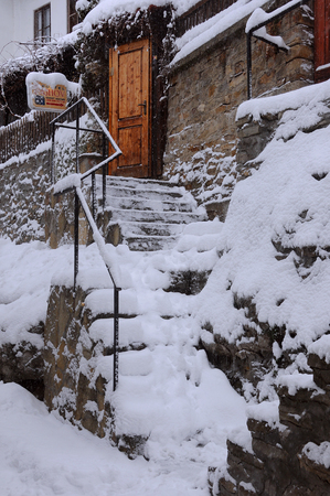 VELIKO TARNOVO, BULGARIA - JANUARY 6, 2016: Snowy steps of Rashov hotel in General Gurko street on the winter dayのeditorial素材