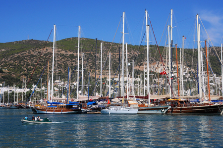 BODRUM, TURKEY - SEPTEMBER 30, 2009: Boats in the port against the hill background in the summerのeditorial素材