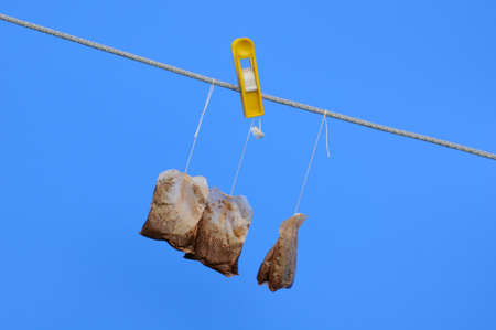 Use teabags are being dried in the sun against the blue sky background to be used agaiの写真素材