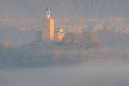 Fuzzy foggy Tsarevets fortress in the town of Veliko Tarnovo early in the morningの写真素材