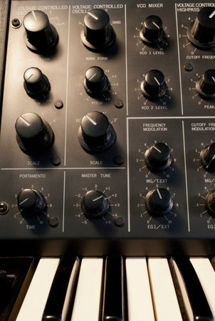 vintage analog synthesizer oscillator bank and keyboard