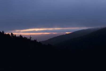 Stunning sunset between mountainsの写真素材