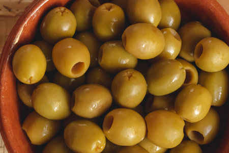 Green olives freshly picked from Spanish olive trees in an artisanal way, ready as an appetizer or accompaniment for cookingの写真素材