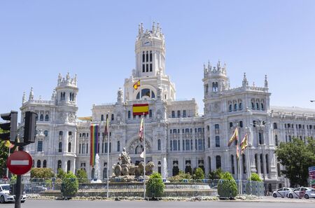 Fa?ade of the City Hall of the city of Madrid, decorated with the rainbow flag during the popular gay pride day celebrationsのeditorial素材