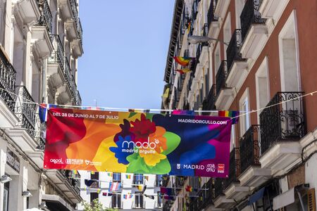 Popular neighborhood of Chueca, known for its numerous neighbors and LGBT environment, decorated and full of life during the day of gay prideのeditorial素材