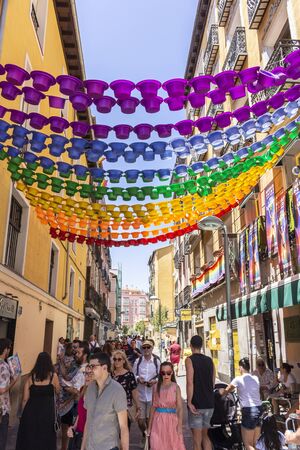 Popular neighborhood of Chueca, known for its numerous neighbors and LGBT environment, decorated and full of life during the day of gay prideのeditorial素材