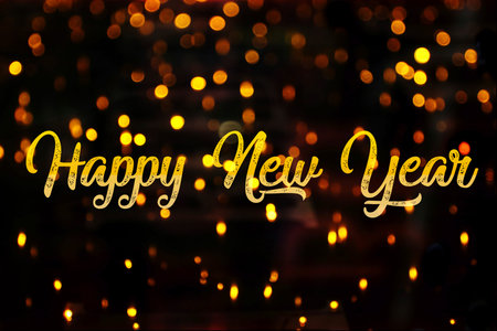 Happy new year in golden letters on a black background with golden lights