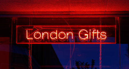 Red neon sign of the words London Gifts