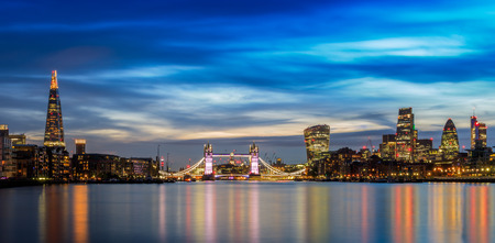 Panoramic view of illuminated London cityscape at sunsetの写真素材