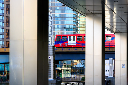 Docklands Light Railway in Canary Wharf, financial district in Londonの写真素材
