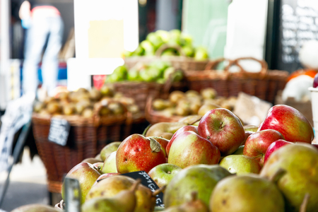 Fresh apples on display at a fruit stand of Borough Market in Londonの写真素材