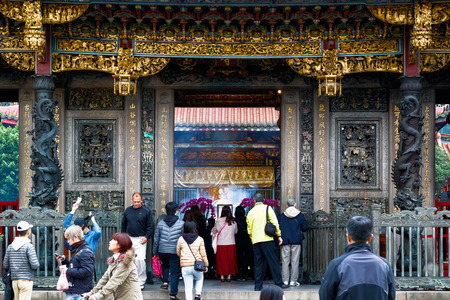 Taipei, Taiwan - January 21, 2017 - Lungshan Temple of Manka packed with worshippers and touristsのeditorial素材
