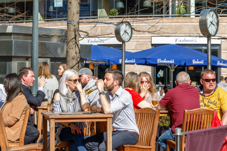 London, UK - May 10, 2017 - Reuters Plaza in Canary Wharf packed with people drinking on a sunny dayのeditorial素材