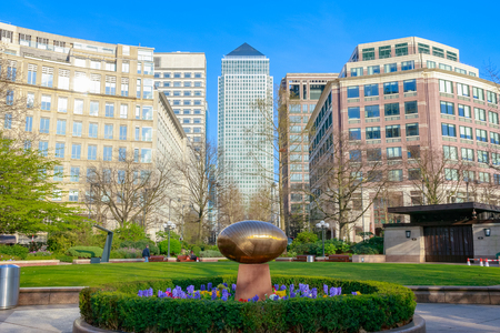 âCosmic Stoneâ by Do Vassilakis-Koning in a peaceful garden at Westferry Circus in Canary Wharf with skyscrapers in the backgroundの写真素材