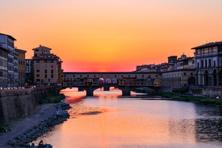 Sunset at Ponte Vecchio (Old Bridge) over the river Arno in Florence, Italyの写真素材