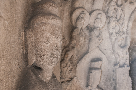 stone Kwan Yin sculpture in the caveの写真素材