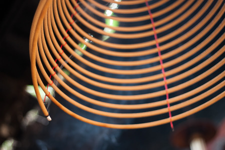 burning chinese circular joss sticksの写真素材