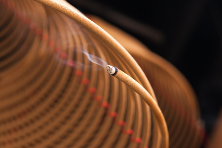 burning chinese circular joss sticksの写真素材