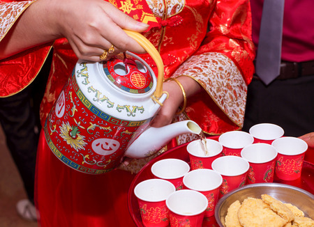 the bride serving the tea for the eldersの写真素材