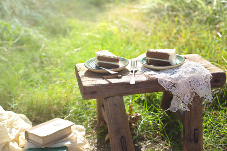 cakes on the wooden table at outdoorの写真素材