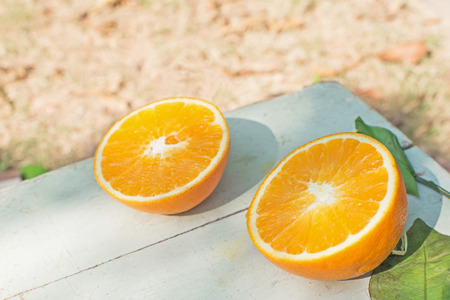 two half of oranges on the tableの写真素材