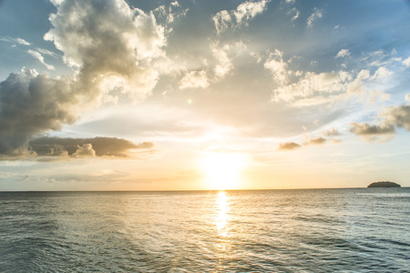sunset on the sea with cloudy sky backgroundの写真素材