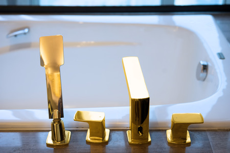 golden taps and sprinklerの写真素材