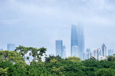 buildings and trees in a cloudy dayの写真素材