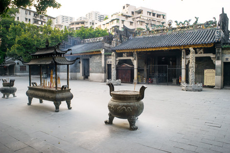 GUANGZHOU, CHINA-Oct. 18, 2015: Incense burners in front of Renwei Temple. Renwei Temple was built in 1052, which is famous for its decorations, such as wood carving, stone carving and brick carving.のeditorial素材