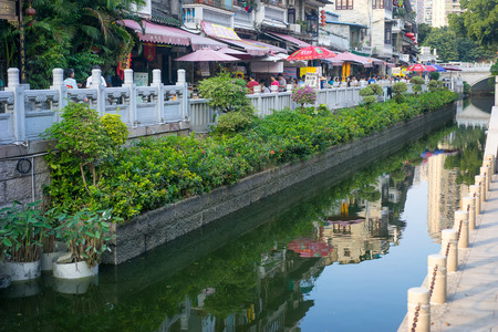 Guangzhou, China-Oct. 24, 2015: Old buildings by Litchi Bay.Along the Litchi Bay there are many historical relics and local shops, now it's a famous tourist attraction in Guangzhou.のeditorial素材