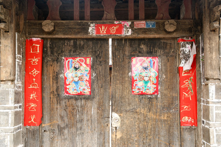 chinese traditional paper-cut in the Dongba character on the doorのeditorial素材