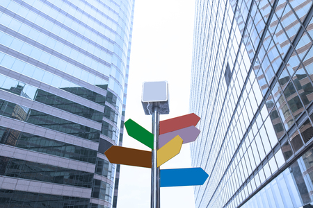 road sign among the modern office buildings in downtownの写真素材