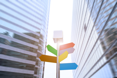road sign among the modern office buildings in downtownの写真素材