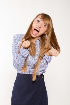Angry young  businesswoman isolated on whiteの写真素材