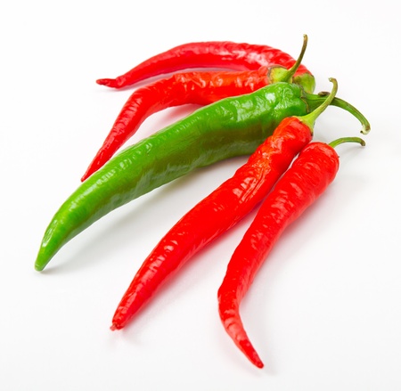 red and green peppers isolated on whiteの写真素材