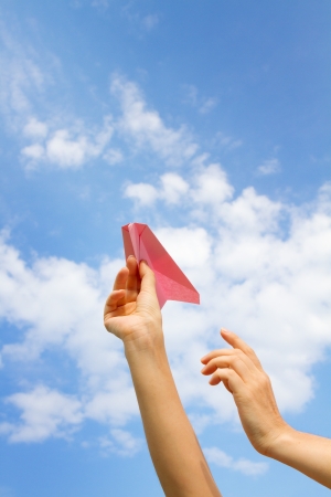 hand with a paper airplane.の写真素材