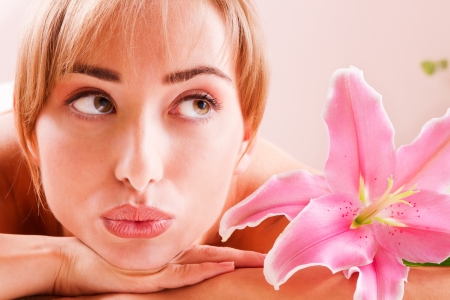 Beatiful women relax in spa with flowerの写真素材