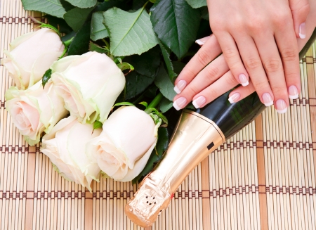 French manicure, white roses and champagneの写真素材