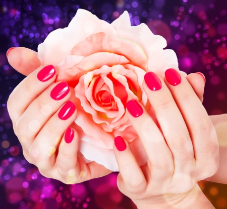  manicure and rose on a beautiful backgroundの写真素材