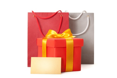  gift red box with  ribbon and gift card on white backgrounの写真素材