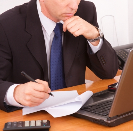 Businessman working on a laptop  close up の写真素材