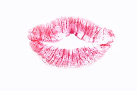 Red lip print close up on a white background.の写真素材