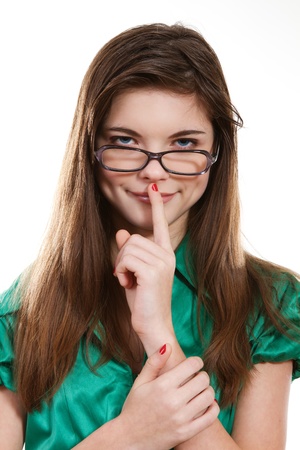 portrait of teenage girl wearing glasses, smiling benevolentlyの写真素材