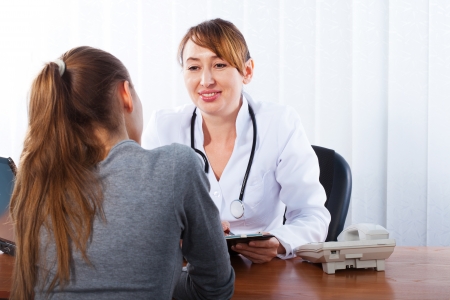 Doctor with female patientの写真素材