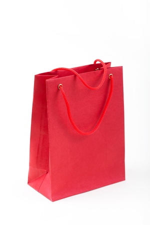 Red paper bag closeup  on white backgroundの写真素材