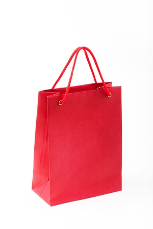Red paper bag closeup  on white backgroundの写真素材