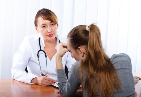 Doctor with female patientの写真素材
