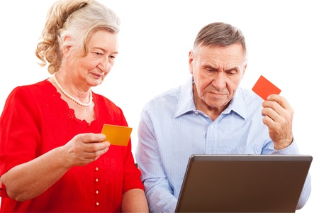 elderly couple doing online shopping の写真素材