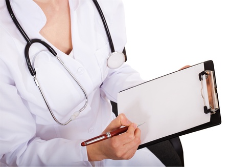Female doctor showing blank clipboardの写真素材