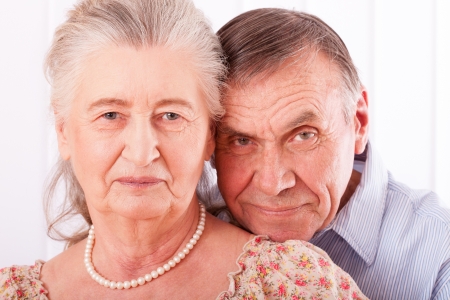 Closeup portrait of smiling elderly coupleの写真素材